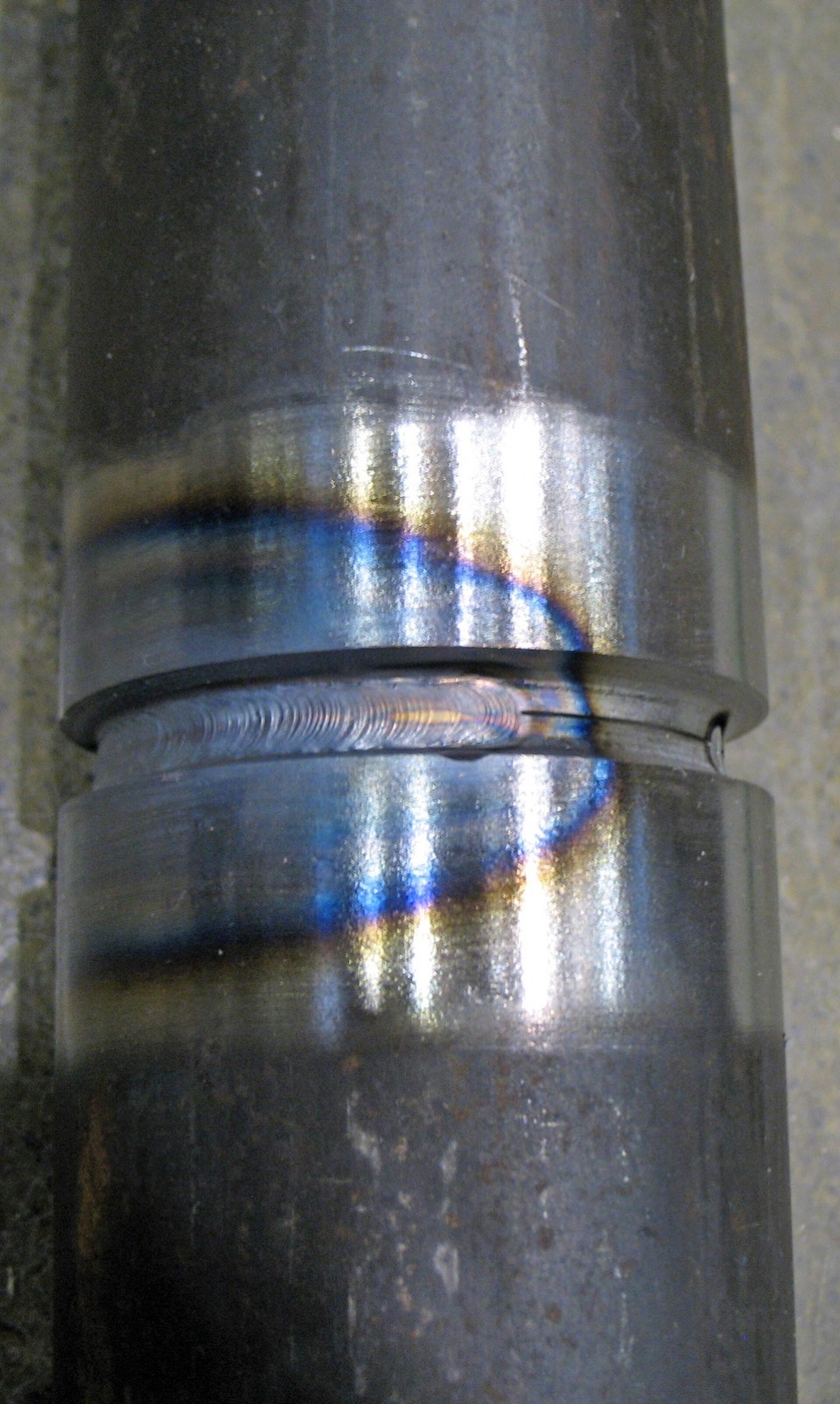 Close-up of a repaired stainless pipe weld